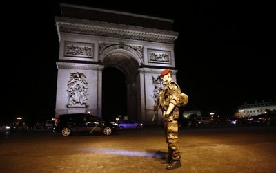 A soldier stands guard near the Arc of Triomphe at the top of the Champs-Elysees avenue in Paris, after a fatal shooting on April 20, 2017. (AP/Kamil Zihnioglu)