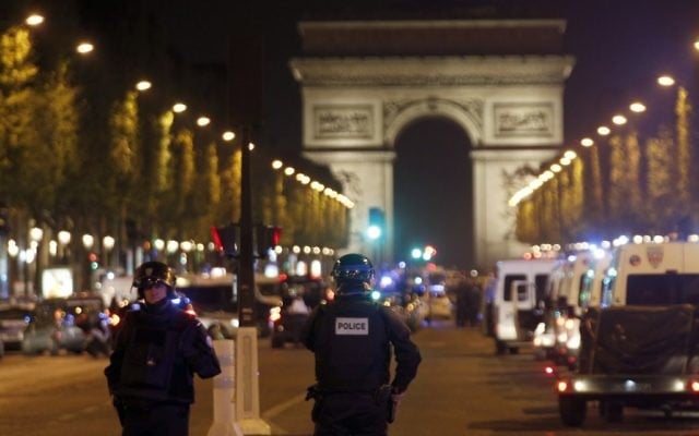 Police seal off the Champs-Elysees avenue in Paris, France, after a fatal shooting in which a police officer was killed along with an attacker, Thursday, April 20, 2017. (AP Photo/Thibault Camus)