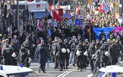 Police secures a protest march against the party convention of Germany's nationalist party AfD (Alternative for Germany) in Cologne, Germany, Saturday, April 22, 2017.  (AP Photo/Martin Meissner)