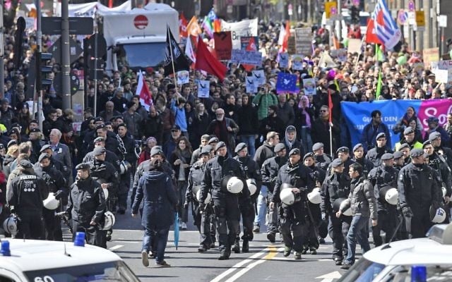Police secures a protest march against the party convention of Germany's nationalist party AfD (Alternative for Germany) in Cologne, Germany, Saturday, April 22, 2017. (AP Photo/Martin Meissner) Police secures a protest march against the party convention of Germany's nationalist party AfD (Alternative for Germany) in Cologne, Germany, Saturday, April 22, 2017. (AP Photo/Martin Meissner)