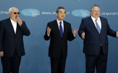 Greek Foreign Minister Nikos Kotzias, right, and his Iranian counterpart Mohammad Javad Zarif, left, and Chinese Foreign Minister Wang Yi gesture as they pose for the photographers as they attend the "Ancient Civilizations Forum" (ACForum) at Zappeio Conference Hall in Athens, April 24, 2017.
 (AP Photo/Thanassis Stavrakis)