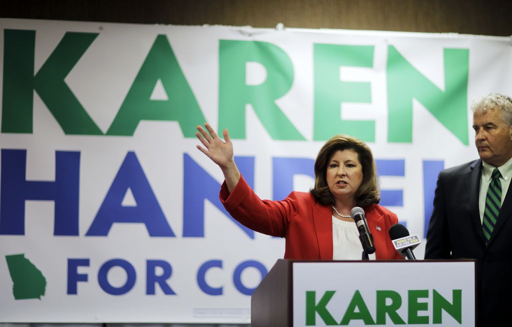 Republican candidate for Georgia's 6th Congressional seat Karen Handel updates supporters with her husband Steve on early results at an election night watch party in Roswell, Georgia, April 18, 2017. (AP Photo/David Goldman) Republican candidate for Georgia's 6th Congressional seat Karen Handel updates supporters with her husband Steve on early results at an election night watch party in Roswell, Georgia, April 18, 2017. (AP Photo/David Goldman)