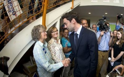 Democratic candidate for Georgia's 6th Congressional seat Jon Ossoff greets supporters at a campaign field office Tuesday, April 18, 2017. (AP Photo/John Bazemore)