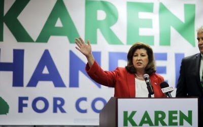 Republican candidate for Georgia's 6th Congressional seat Karen Handel, left, updates supporters with her husband Steve on early results at an election night watch party in Roswell, Ga., Tuesday, April 18, 2017.(AP/David Goldman) 