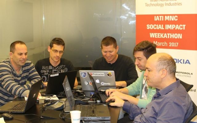 Team at work at IATI's Social Impact Weekathon (IATI)