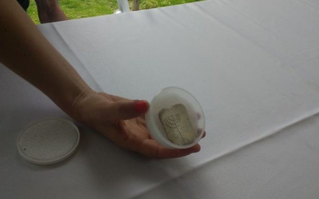A mother-of-pearl tablet inscribed with a menorah found in Caesarea, Israel, April 2017. (Ilan Ben Zion/Times of Israel)