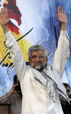 In this file photo taken on Wednesday, June 12, 2013, Iranian presidential candidate Saeed Jalili waves to his supporters in a campaign rally in Tehran, Iran. (AP Photo/Vahid Salemi, File)