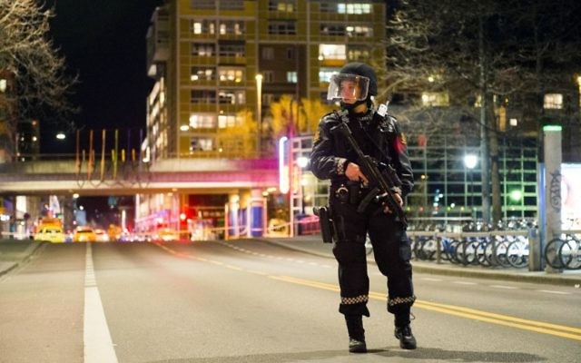 An officer stands guard as police cordon off a large area around a subway station on a busy commercial street Saturday night, April 8, 2017, after finding what they described as a "bomb-like" device, in Oslo, Norway. (Fredrik Varfjell /NTB scanpix via AP) An officer stands guard as police cordon off a large area around a subway station on a busy commercial street Saturday night, April 8, 2017, after finding what they described as a "bomb-like" device, in Oslo, Norway. (Fredrik Varfjell /NTB scanpix via AP)