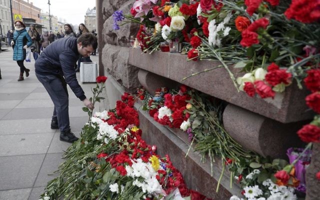 A man lays flowers at a symbolic memorial outside the Tekhnologichesky Institute subway station in St. Petersburg, Russia, April 4, 2017. (AP/Dmitri Lovetsky) A man lays flowers at a symbolic memorial outside the Tekhnologichesky Institute subway station in St. Petersburg, Russia, April 4, 2017. (AP/Dmitri Lovetsky)