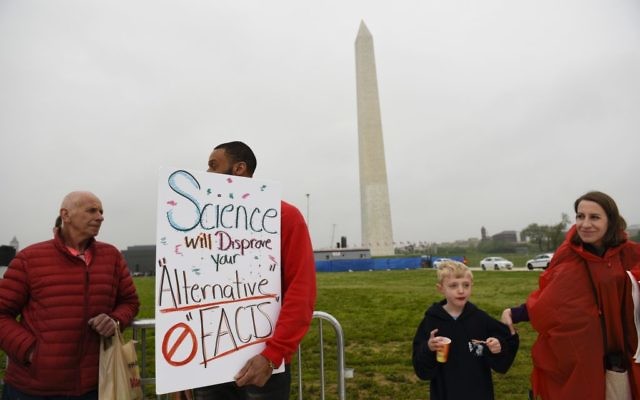 People arrive at the March for Science event near the Washington Monument in Washington, Saturday, April 22, 2017. Thousands of scientists worldwide left their labs to take to the streets Saturday along with students and research advocates in pushing back against what they say are mounting attacks on science. (AP Photo/Sait Serkan Gurbuz)