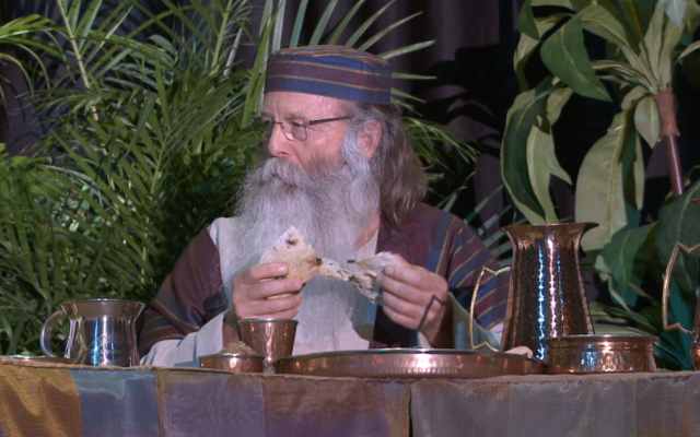 Michael Rood breaks matzah at the huge seder event 'The Road to Redemption' on Easter weekend near Charlotte, North Carolina. (Courtesy)