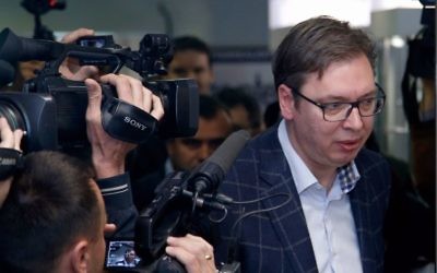 Current Serbian Prime Minister and presidential candidate Aleksandar Vucic, right, arrives at a polling station to cast his ballot, in Belgrade, Serbia, Sunday, April 2, 2017. (AP Photo/Darko Vojinovic)