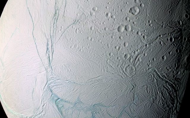 This June 28, 2009 image provided by NASA, taken by the international Cassini spacecraft, shows Enceladus, one of Saturn's moons. (AP Photo/NASA) This June 28, 2009 image provided by NASA, taken by the international Cassini spacecraft, shows Enceladus, one of Saturn's moons. (AP Photo/NASA)