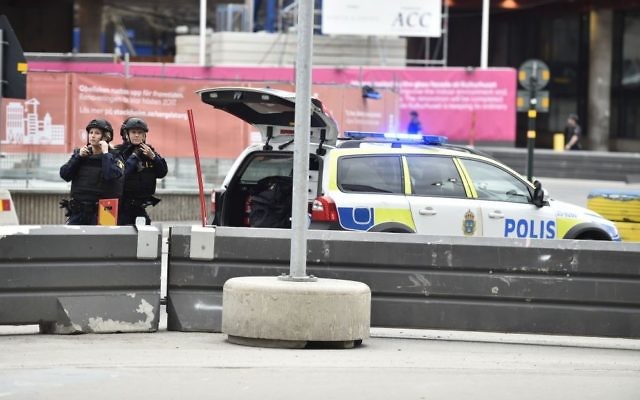 Police attend the scene after a truck crashed into a department store injuring several people in central Stockholm, Sweden, Friday April 7, 2017. (Noella Johansson, TT News Agency via AP) 