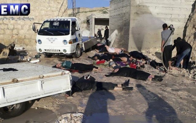 This photo provided Tuesday, April 4, 2017 by the Syrian anti-government activist group Edlib Media Center, which has been authenticated based on its contents and other AP reporting, shows victims of a suspected chemical attack, in the town of Khan Sheikhoun, northern Idlib province, Syria. (Edlib Media Center, via AP)