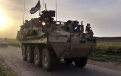 This Friday, April 28, 2017 still taken from video, shows US forces patrolling on a rural road in the village of Darbasiyah, in northern Syria. (AP Photo via APTV)
