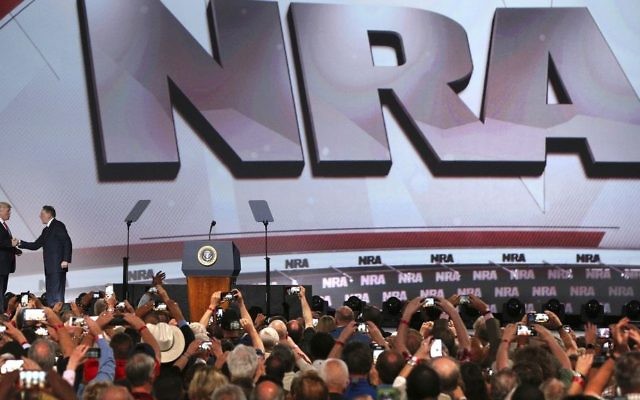 President Donald Trump, left, shakes hands with National Rifle Association Executive Vice President Wayne LaPierre as he arrives for the National Rifle Association Leadership Forum, Friday, April 28, 2017, in Atlanta. (Curtis Compton/Atlanta Journal-Constitution via AP) President Donald Trump, left, shakes hands with National Rifle Association Executive Vice President Wayne LaPierre as he arrives for the National Rifle Association Leadership Forum, Friday, April 28, 2017, in Atlanta. (Curtis Compton/Atlanta Journal-Constitution via AP)