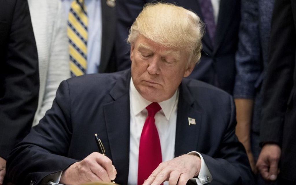 Illustrative image of US President Donald Trump signing the Education Federalism Executive Order during a federalism event with governors in the Roosevelt Room of the White House in Washington, April 26, 2017. (AP/Andrew Harnik) Illustrative image of US President Donald Trump signing the Education Federalism Executive Order during a federalism event with governors in the Roosevelt Room of the White House in Washington, April 26, 2017. (AP/Andrew Harnik)