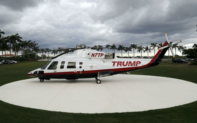 A personal helicopter of President Donald Trump sits on the helipad at Mar-a-Lago, Sunday, April 9, 2017, in Palm Beach, Florida. (AP Photo/Alex Brandon)