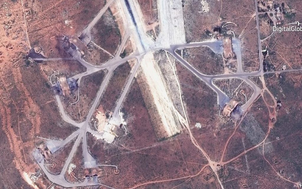 This satellite image provided by DigitalGlobe shows an image captured on April 7 of destroyed aircraft shelters on the southeast side of the Shayrat air base in Syria, following US Tomahawk Land Attack Missile strikes on Friday, April 7, 2017 from the USS Ross (DDG 71) and USS Porter (DDG 78). (DigitalGlobe via AP)