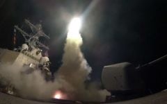 In this image provided by the US Navy, the guided-missile destroyer USS Porter (DDG 78) launches a tomahawk land attack missile in the Mediterranean Sea, Friday, April 7, 2017. (Mass Communication Specialist 3rd Class Ford Williams/US Navy via AP)
