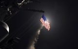 In this image provided by the U.S. Navy, the guided-missile destroyer USS Porter (DDG 78) launches a tomahawk land attack missile in the Mediterranean Sea, Friday, April 7, 2017. (Mass Communication Specialist 3rd Class Ford Williams/U.S. Navy via AP)