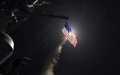 In this image provided by the U.S. Navy, the guided-missile destroyer USS Porter (DDG 78) launches a tomahawk land attack missile in the Mediterranean Sea, Friday, April 7, 2017. (Mass Communication Specialist 3rd Class Ford Williams/U.S. Navy via AP)