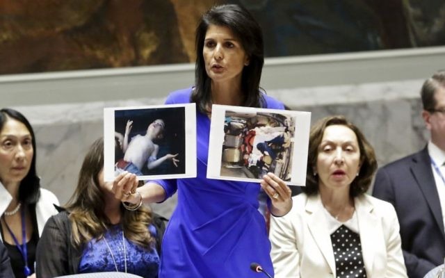 US Ambassador to the UN Nikki Haley shows pictures of Syrian victims of chemical attacks as she addresses a meeting of the Security Council on Syria at UN headquarters on April 5, 2017. (AP Photo/Bebeto Matthews) US Ambassador to the UN Nikki Haley shows pictures of Syrian victims of chemical attacks as she addresses a meeting of the Security Council on Syria at UN headquarters on April 5, 2017. (AP Photo/Bebeto Matthews)