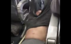 This Sunday, April 9, 2017, image shows a passenger being removed from a United Airlines flight in Chicago. Video of police officers dragging the passenger from an overbooked United Airlines flight sparked an uproar Monday on social media. (Audra D. Bridges via AP)