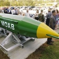 In this May 2004 photo, a group gathers around a GBU-43B, or massive ordnance air blast (MOAB) weapon, on display at the Air Force Armament Museum on Eglin Air Force Base near Valparaiso, Fla. (Mark Kulaw/Northwest Florida Daily News via AP)