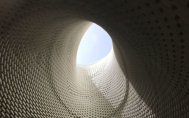 The site's central column, made from 6,000 stone bricks, opens into a "bell light" 18 meters above the ground, April 27, 2017. (Luke Tress/Times of Israel) The site's central column, made from 6,000 stone bricks, opens into a "bell light" 18 meters above the ground, April 27, 2017. (Luke Tress/Times of Israel)