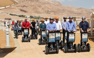 Tourism Minister Yariv Levin, center front, takes a segway tour of the new promenade along Ein Boqek on April 3, 2017. (courtesy Mickey Lengental)