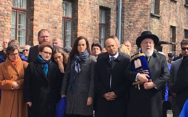 Rabbi Yisrael Meir Lau (r), Education Minister Naftali Bennett (2r) join participants in the March of the Living in Auschwitz concentration camp, April 24, 2017 (Courtesy) Rabbi Yisrael Meir Lau (r), Education Minister Naftali Bennett (2r) join participants in the March of the Living in Auschwitz concentration camp, April 24, 2017 (Courtesy)