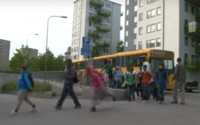 Pupils arriving by school bus at the privately-run Al-Azhar Primary School in a suburb of Stockholm, Sweden. (YouTube screenshot)