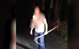 US tourist wielding steel bar yells at cops to shoot him after 'Jesus told him to go north,' in northern Israel,  April 13, 2017 (Screen capture: YouTube, police spokesperson)