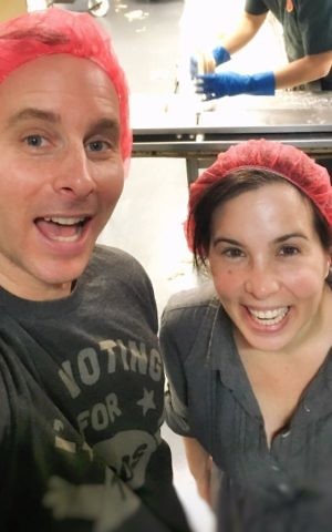 Kevin Rodriguez, left, and Ashley Albert at the matzah factory. (Courtesy) 