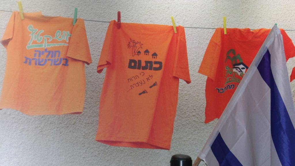 The color orange symbolized the resistance to disengagement. The center shirt reads "Orange: because the spirit doesn't stop." (Shmuel Bar-Am) The color orange symbolized the resistance to disengagement. The center shirt reads "Orange: because the spirit doesn't stop." (Shmuel Bar-Am)