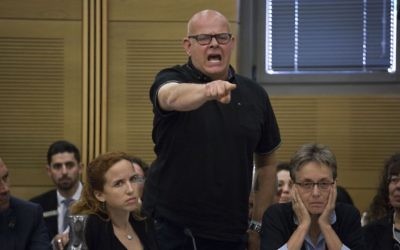 Bereaved father Ilan Sagi speaks out at the Knesset State Control Committee discussion about the 2014 Gaza war on April 19, 2017. Lea Goldin is sitting to his right. (Hadas Parush/Flash90)