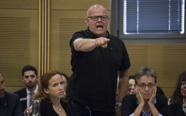 Bereaved father Ilan Sagi speaks out at the Knesset State Control Committee discussion about the 2014 Gaza war on April 19, 2017. Lea Goldin is sitting to his right. (Hadas Parush/Flash90)