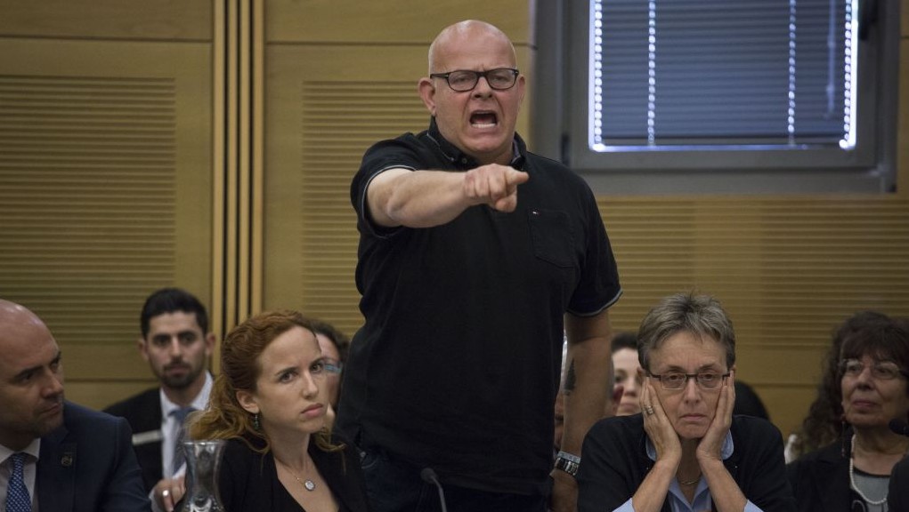 Bereaved father Ilan Sagi speaks out at the Knesset State Control Committee discussion about the 2014 Gaza war on April 19, 2017. Lea Goldin is sitting to his right. (Hadas Parush/Flash90) Bereaved father Ilan Sagi speaks out at the Knesset State Control Committee discussion about the 2014 Gaza war on April 19, 2017. Lea Goldin is sitting to his right. (Hadas Parush/Flash90)