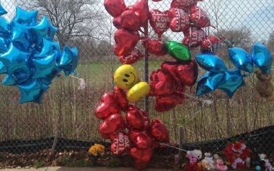 A makeshift memorial along a fence close to the spot where Robert Godwin Sr. was killed in Cleveland on Monday, April 17, 2017. Police said Steve Stephens killed Godwin on April 16, 2017, and posted the video on Facebook. (AP/Mike Householder)