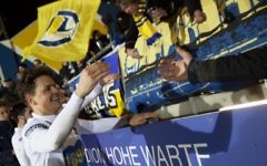 Ali Sahintuerk (L) of the First Vienna Football Club 1894 greets the fans after the regional League East game between First Vienna Football Club 1894 vs Parndorf in the Hohe Warte stadium in Vienna, on March 10, 2017. (AFP PHOTO / ALEX HALADA)