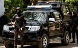 Illustrative: Egyptian security forces stand guard around the Coptic Catholic College of Theology and Humanities in the southern Cairo suburb of Maadi on April 29, 2017, during Pope Francis's visit to the country. (AFP/Aly Fahim)