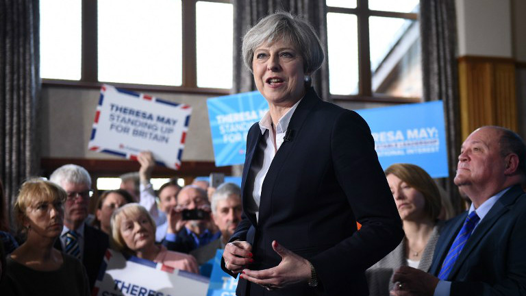 British Prime Minister Theresa May delivers a speech to Conservative Party supporters in Mawdesley Village Hall near Ormskirk, in north west England on May 1, 2017 as campaigning continues in the build up to the general election on June 8, 2017. (AFP/Oli Scarff) British Prime Minister Theresa May delivers a speech to Conservative Party supporters in Mawdesley Village Hall near Ormskirk, in north west England on May 1, 2017 as campaigning continues in the build up to the general election on June 8, 2017. (AFP/Oli Scarff)