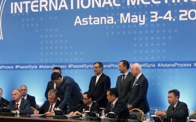 Russian mediator Alexander Lavrentiev, Iranian deputy foreign minister Hossein Jaberi Ansari, Kazakh Foreign Minister Kairat Abdrakhmanov and UN Special Envoy for Syria Staffan de Mistura attend the signing of a memorandum on creating safe zones in Syria during the fourth round of Syria peace talks in Astana on May 4, 2017. (Stanislav FILIPPOV / AFP)