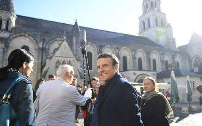 French presidential candidate Emmanuel Macron, center, campaigning ahead of the second and final round of the presidential elections, April 29, 2017, in Poitiers, central France. (Eric Feferberg/AFP)