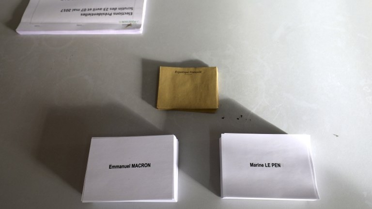Ballots with the names of the two French presidential candidates are placed on a table at a polling station in Saint-Leu, Reunion, on May 7, 2017, during the second round of the French presidential election. (AFP Photo/Richard Bouhet) Ballots with the names of the two French presidential candidates are placed on a table at a polling station in Saint-Leu, Reunion, on May 7, 2017, during the second round of the French presidential election. (AFP Photo/Richard Bouhet)
