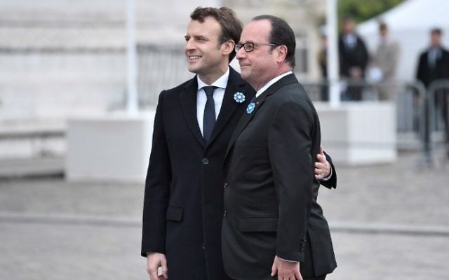French President-elect Emmanuel Macron, left, and outgoing President Francois Hollande attend a ceremony to mark the end of World War II at the Arc de Triomphe in Paris, Monday, May 8, 2017. (AFP Photo/Pool/Stephane De Sakutin) French President-elect Emmanuel Macron, left, and outgoing President Francois Hollande attend a ceremony to mark the end of World War II at the Arc de Triomphe in Paris, Monday, May 8, 2017. (AFP Photo/Pool/Stephane De Sakutin)