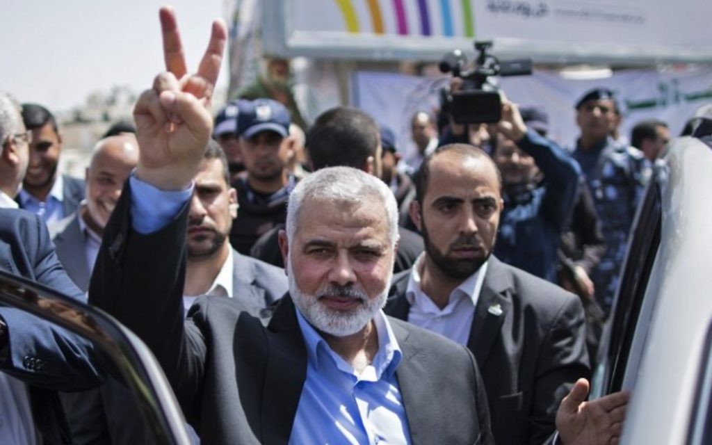 Newly elected Hamas chief, Ismail Haniya, flashes the V-sign after visiting protesters taking part in a sit-in in support of Palestinian hunger-striking prisoners held in Israeli jails, on May 8, 2017, in Gaza City. (AFP Photo/Mahmud Hams)