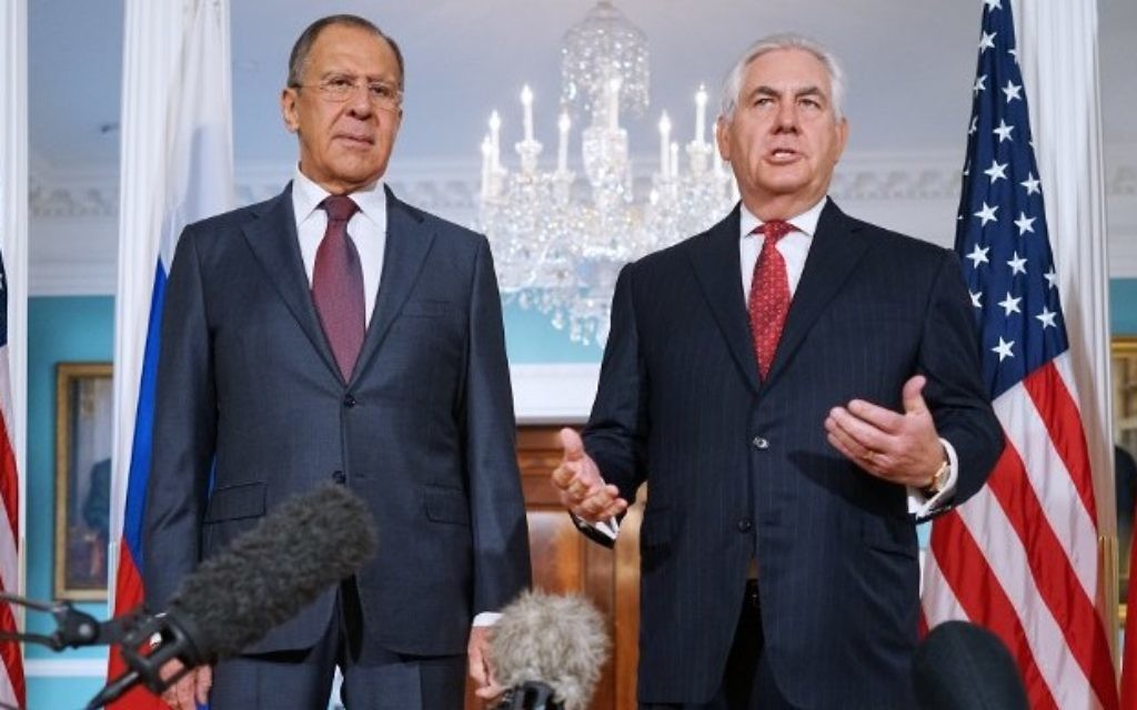 US Secretary of State Rex Tillerson (R) speaks while posing for photos with Russian Foreign Minister Sergei Lavrov in the Treaty Room of the State Department in Washington,  (AFP PHOTO / MANDEL NGAN)